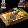 Фото к позиции меню Люля-кебаб из баранины с гарниром, салатом и соусами