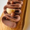 Фото к позиции меню Французский эклер шоколад-фундук Миди