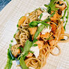 Фото к позиции меню Спагетти с осьминогом, помидорами черри и козьим сыром
