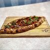 Фото к позиции меню Турецкая пицца пиде с картофелем и беконом