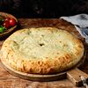 Фото к позиции меню Осетинский Пирог с сыром и зеленью