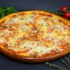 Фото к позиции меню Пицца Четыре сыра с томатами