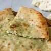 Фото к позиции меню Осетинский пирог с сыром и зелёным луком