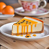 Фото к позиции меню Запеченый чизкейк с морковным бисквитом и соусом апельсин-маракуйя