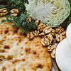 Фото к позиции меню Осетинский пирог с сыром и кинзой