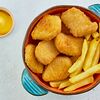 Фото к позиции меню Куриные наггетсы с картофелем фри и сырным соусом