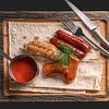 Фото к позиции меню Колбаски на гриле с томатным соусом