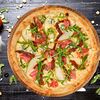 Фото к позиции меню Пицца с прошутой и томатами