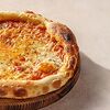 Фото к позиции меню Пицца Четыре сыра 23 см
